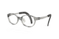 A pair of modern round eyeglasses with a translucent smoky gray frame and black temple tips, shown on a clean white background.
